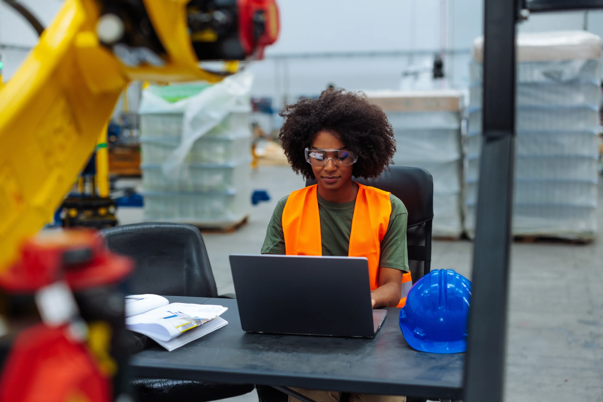 Industrial,Engineer,Wearing,Safety,Vest,And,Glasses,Using,Laptop,In Warehouse Controls Programming